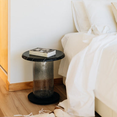 bubble side table next to bed