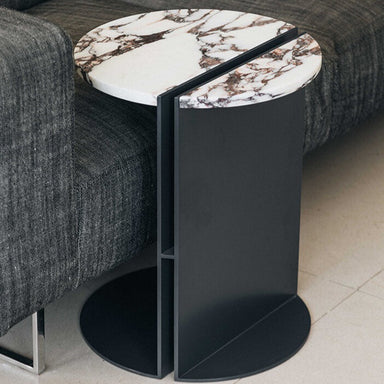 half marble side table next to sofa